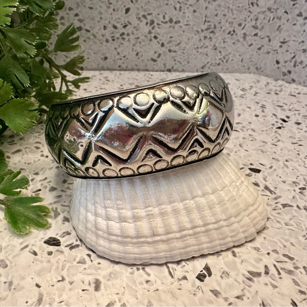 Silver tone textured metal hollow bangle bracelet